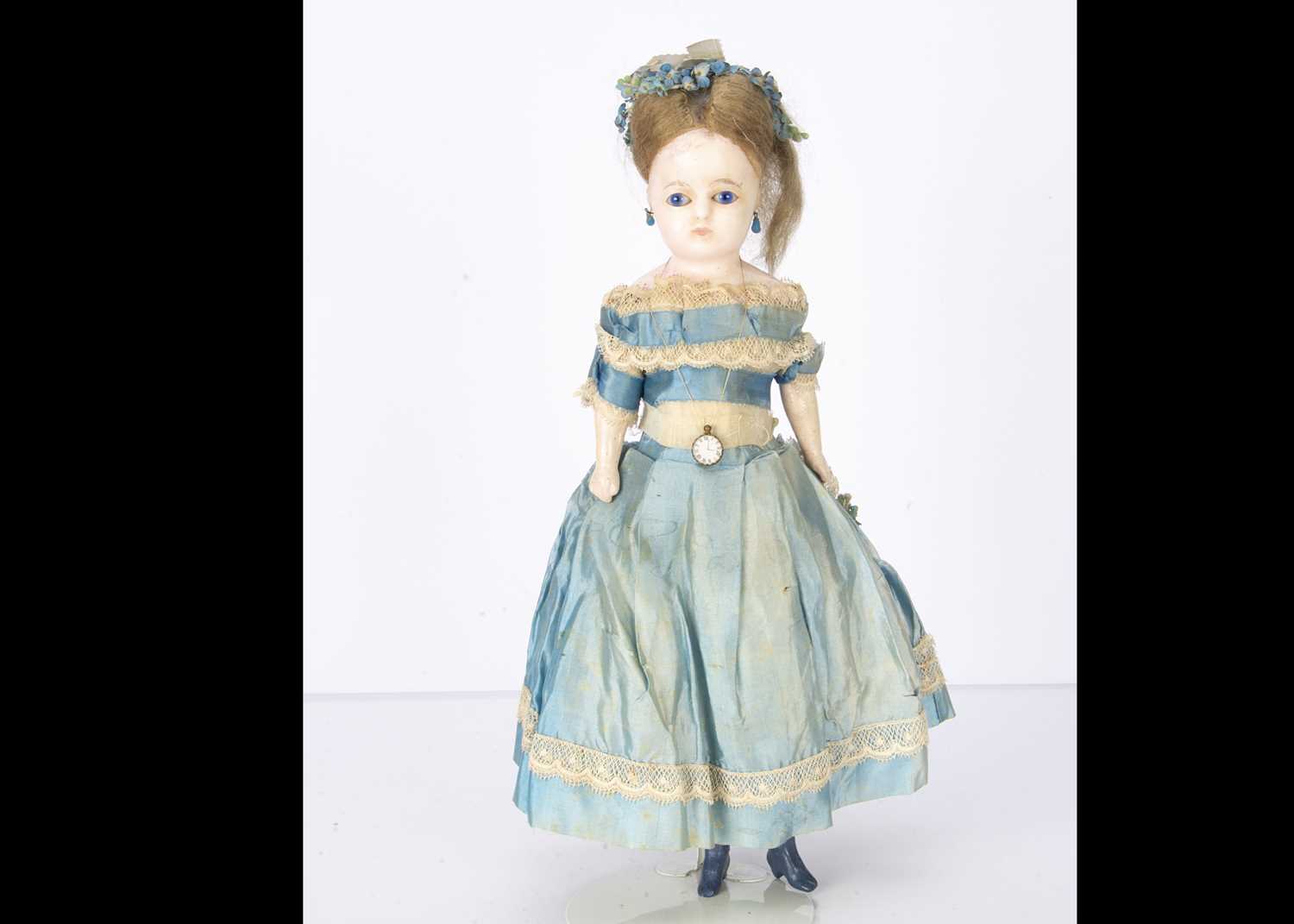 Lot 1191 - A German mid 19th century dipped wax over composition shoulder head child doll