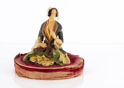 Lot 1197 - A rare mid 19th century tinted wax Henrietta Wade figure of a seated woman