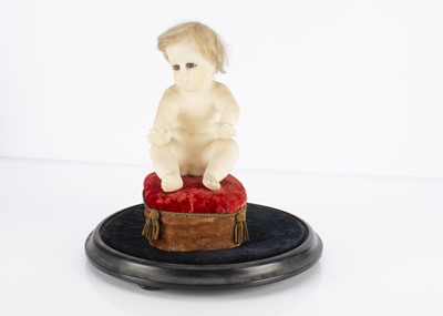 Lot 1201 - A Continental solid wax seated figure of the Baby Jesus