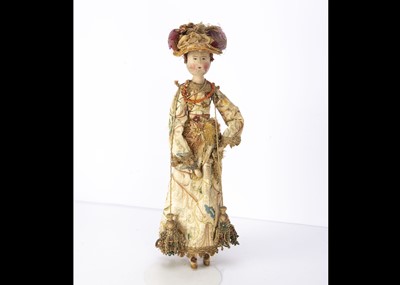 Lot 1203 - A 20th century turned and painted wooden doll