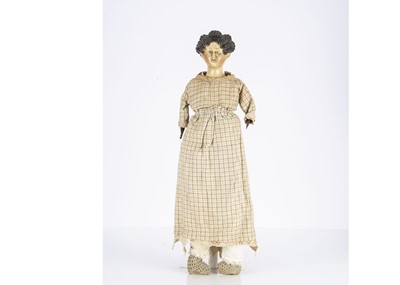 Lot 1205 - A mid 19th century German papier-mache shoulder-head doll with elaborate hair