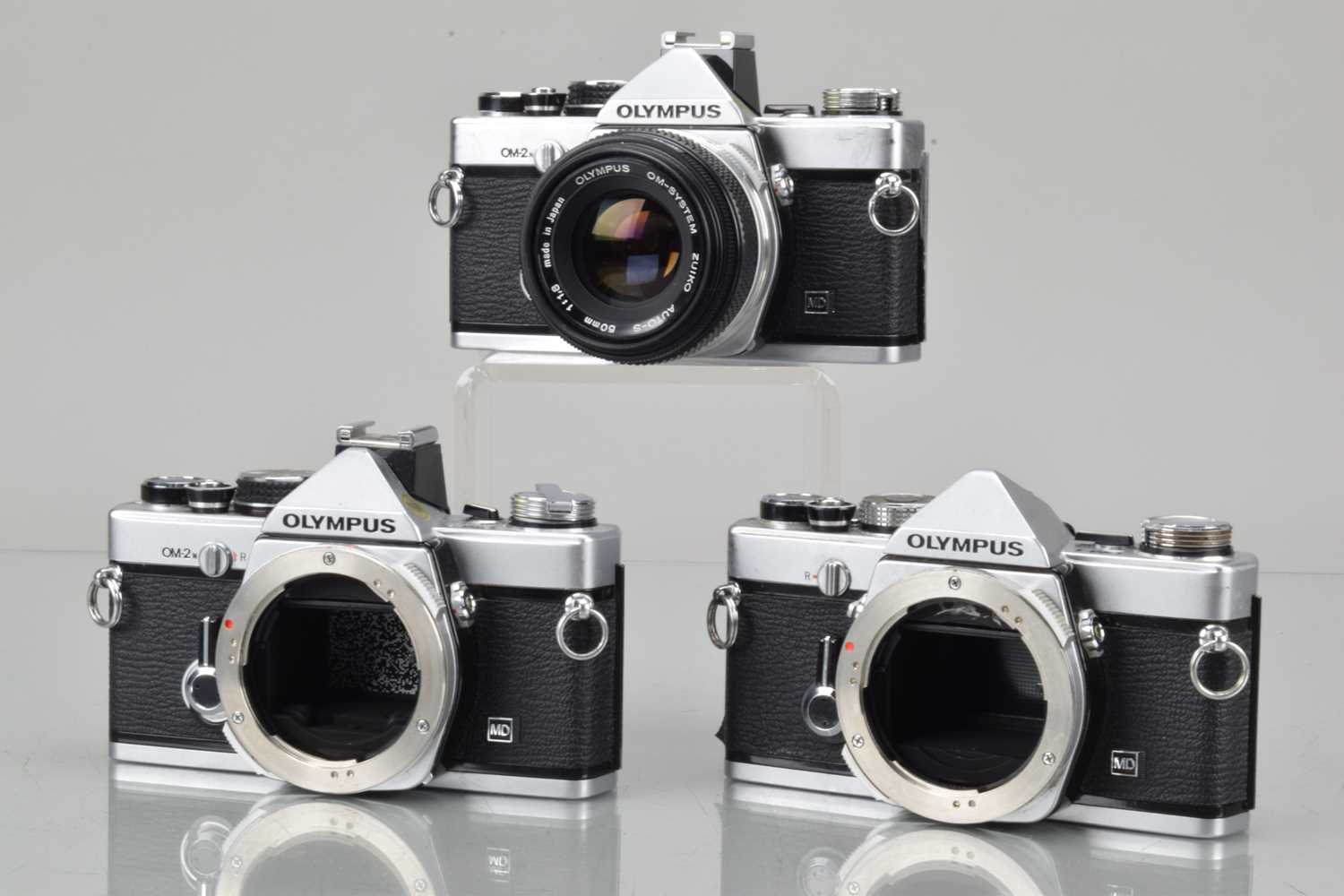 Lot 46 - Three Olympus OM SLR Cameras