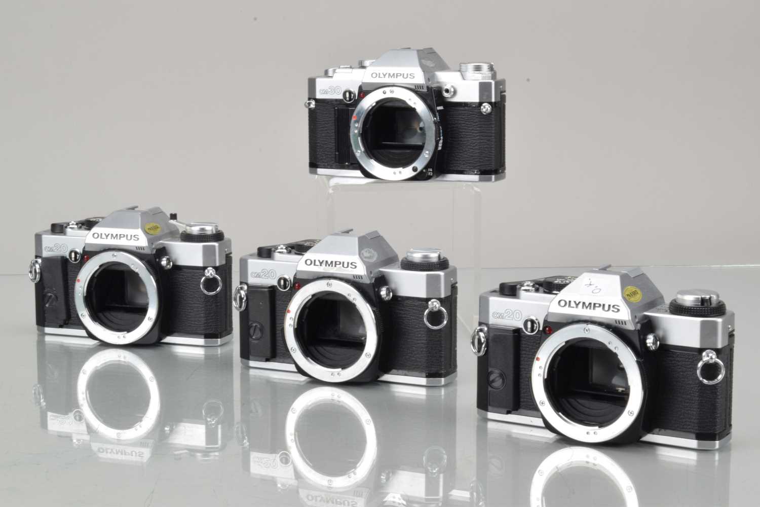 Lot 48 - Four Olympus OM SLR Camera Bodies