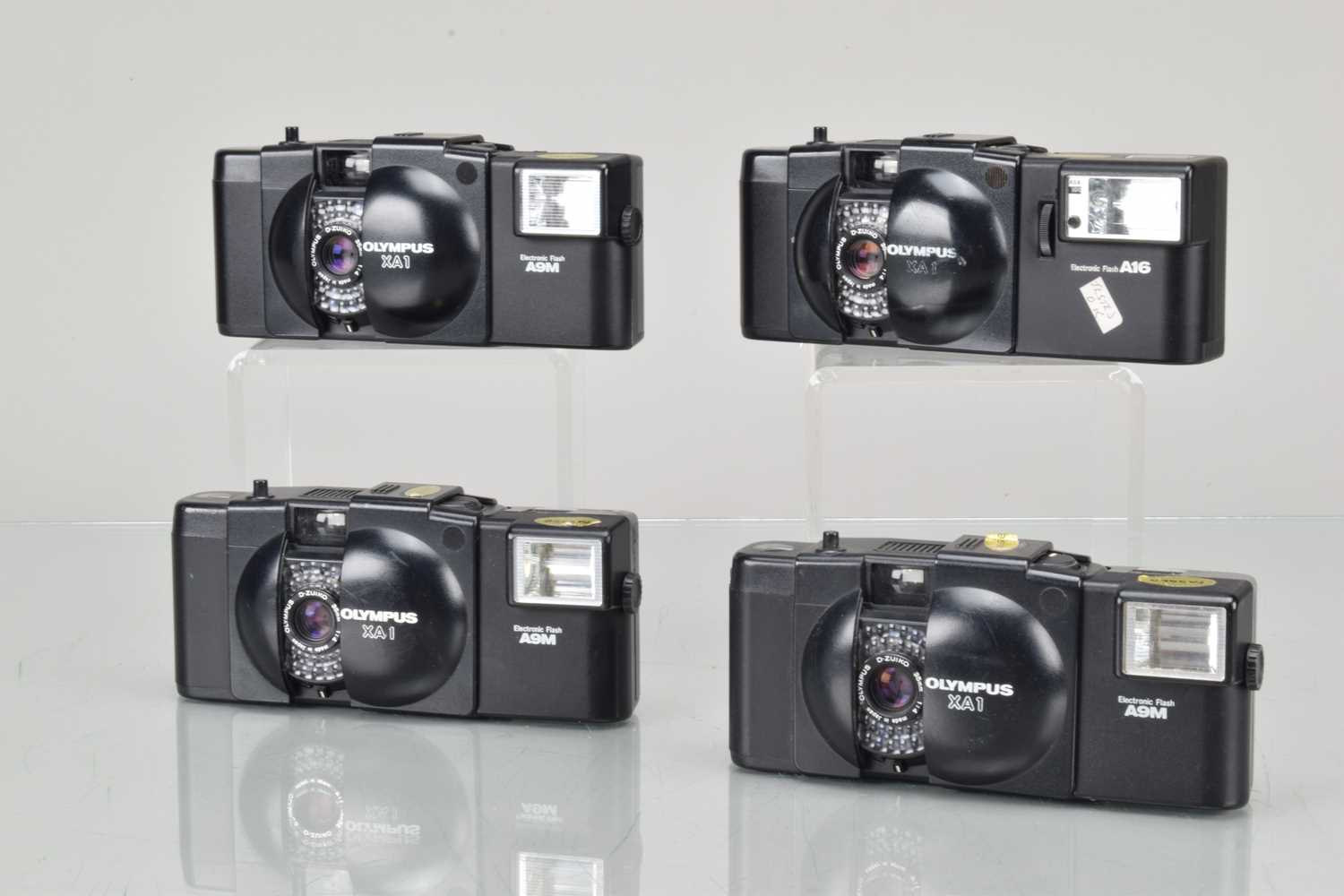 Lot 94 - Four Olympus XA 1 Compact Cameras