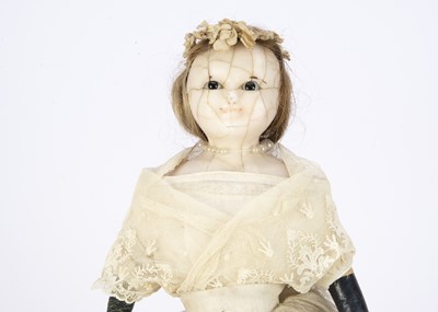 Lot 1258 - An early 19th century English wax over papier-mache child doll