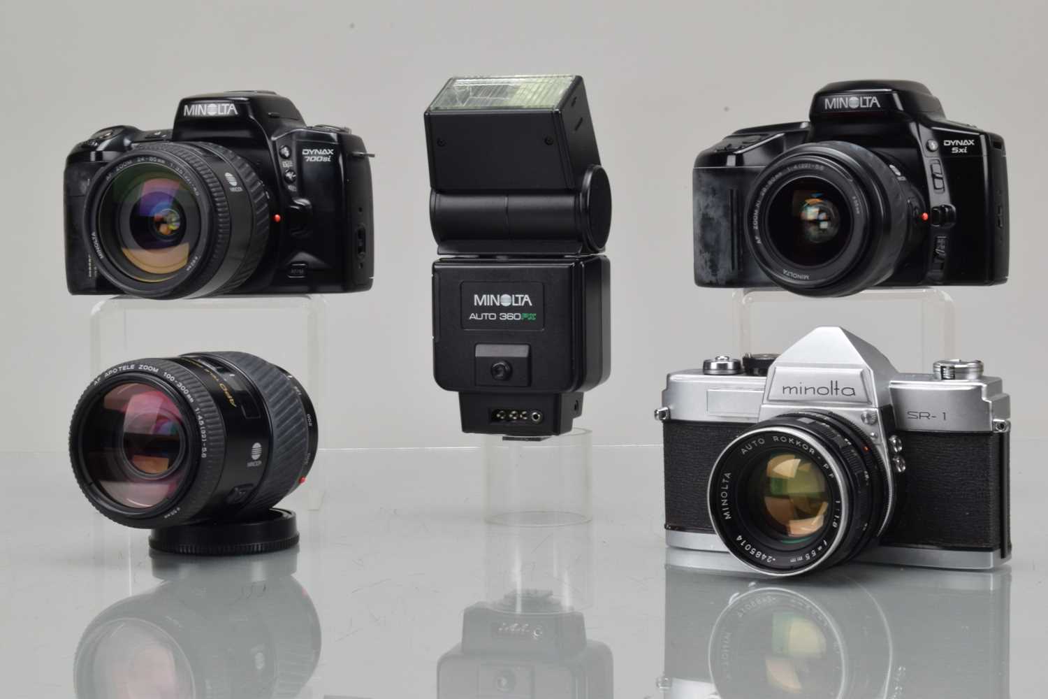 Lot 313 - Three Minolta SLR Cameras