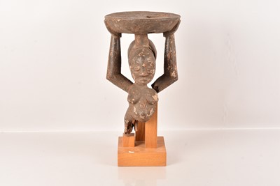 Lot 13 - A carved African stool