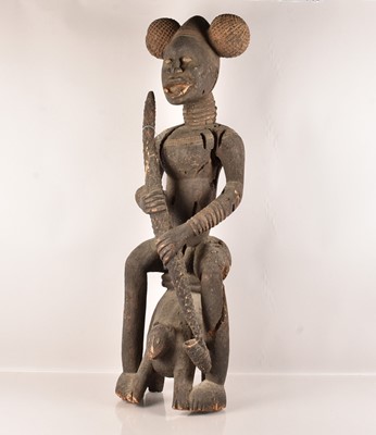 Lot 17 - A large carved African Smoking Male figure
