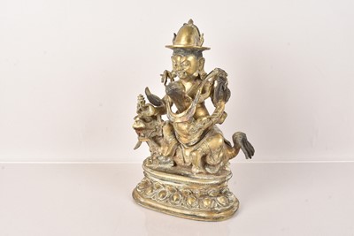 Lot 69 - A Tibetan Bronze Vaishravana on a Lion
