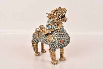 Lot 99 - A Nepalese turquoise and bone Lion/Mythical Beast figure