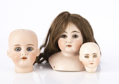 Lot 1306 - Three German bisque doll’s heads