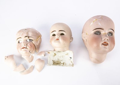 Lot 1307 - Three broken bisque doll’s heads to restored