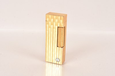Lot 134 - A 1980s gold plated Dunhill Rollagas pocket lighter