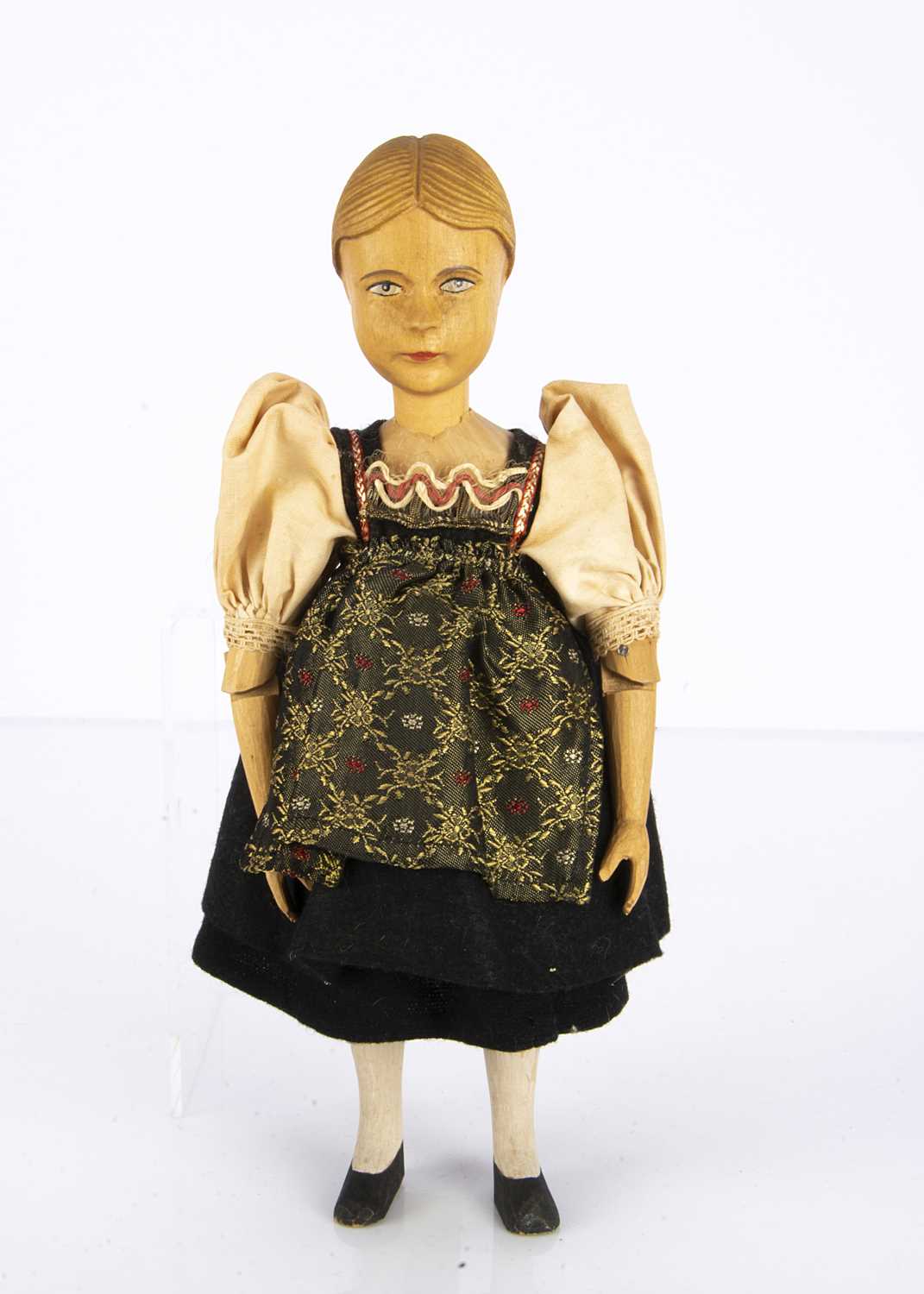 Lot 1328 - A Swiss carved wooden girl doll