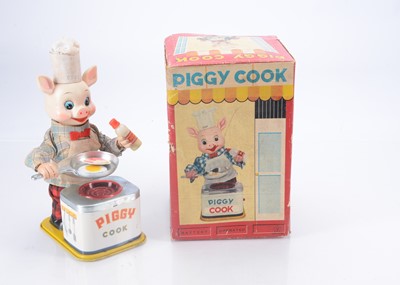 Lot 309 - A Yonezawa Tinplate Battery-Operated Piggy Cook