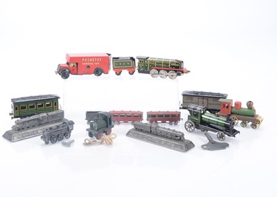 Lot 333 - Tin plate and Diecast floor Toy Trains and other tin Trains with Britains diecast Railway paperweights and Brimtoy Pocketoy (13)