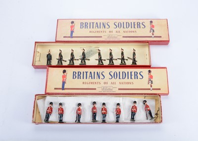Lot 587 - Britains post WW2 8pce sets in ROAN boxes comprising 2072 Kings Royal Rifle Corps and 2082 The Coldstream Guards