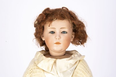 Lot 1408 - A rare Gebruder Heubach 6970 character girl with glass eyes