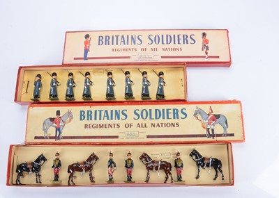 Lot 590 - Britains post WW2 sets in ROAN boxes comprising 182 The 11th Hussars (Prince Albert's Own) (Dismounted) and 8pce 312 Grenadier Guards (Winter Overcoats)