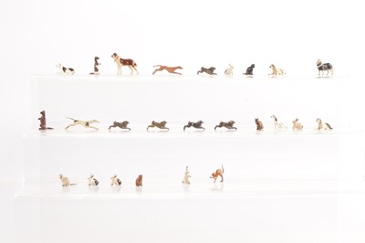 Lot 642 - Small collection of Britains small farm and home animals comprising rare Dog Sitting and Dog Lying with unpainted collar