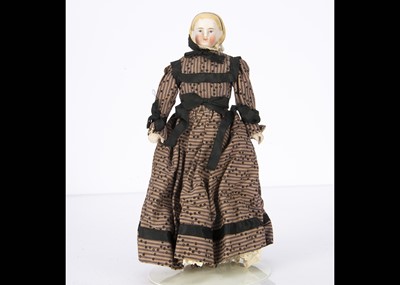 Lot 1437 - A small bisque shoulder head doll