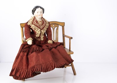 Lot 1462 - A 19th German china shoulder head pink tinted doll