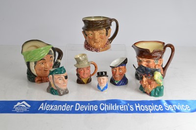 Lot 15 - A group of eight Royal Doulton and other pottery character and Toby style jugs