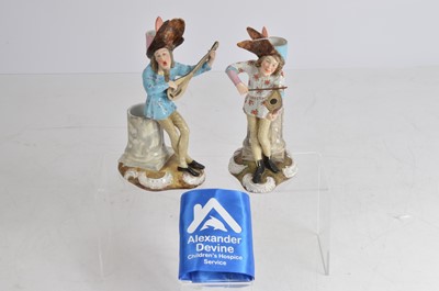 Lot 18 - A pair of Dresden porcelain figural candlesticks and spill vases