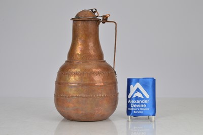 Lot 76 - Middle eastern hand beaten copper jug with lid