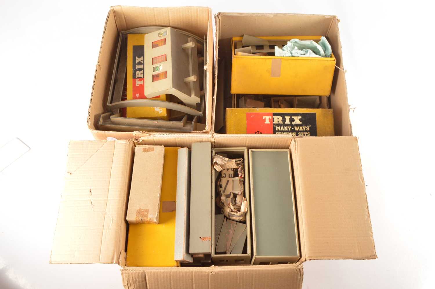 Lot 150 - Large collection of Trix 00 Gauge boxed and unboxed Manyways including Stations Platforms Huts Sheds Signal Boxes Canopy and Buffers (large qty in three boxes)
