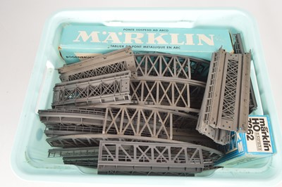 Lot 324 - Four Marklin HO Gauge boxed  and unboxed metal and plastic Girder bridges and various curved and straight ramps and brick piers (qty)