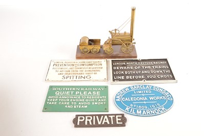 Lot 366 - Brass model of an early locomotive together with reproduction signs (6)