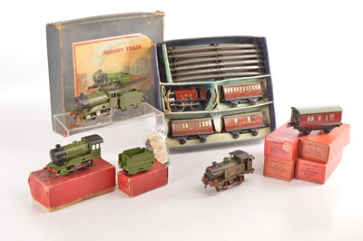 Lot 376 - Hornby 0 Gauge mixed group of Clockwork Pre and Post war Locomotives and passenger coaches (8)