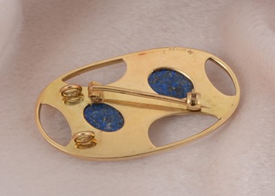 Lot 12 - A modernist 18ct gold ovoid and lapis lazuli brooch
