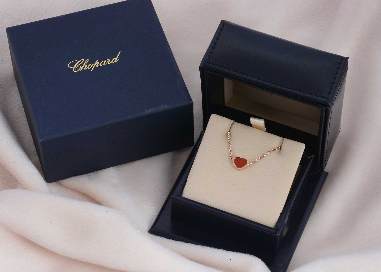 Lot 18 - A Chopard 18ct gold and carnelian heart shaped bracelet