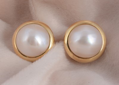 Lot 22 - A pair of continental 14k marked 14k Mabe pearl ear studs