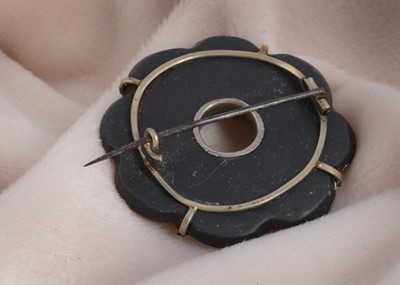 Lot 23 - A 19th Century Scottish hardstone and slate mounted plaid brooch