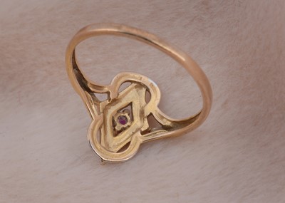 Lot 27 - A 9ct gold ruby enamel and two colour gold dress ring