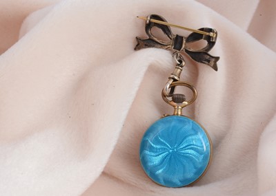 Lot 47 - A continental silver gilt and enamel lady's fob watch and matching bow brooch