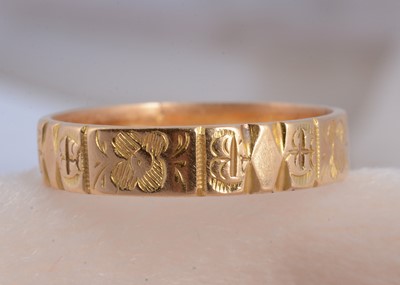Lot 49 - An 18ct gold flattened wedding band