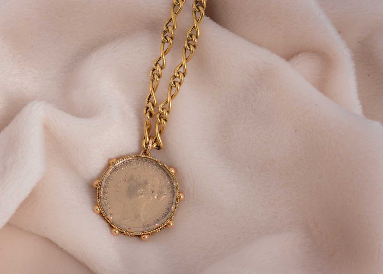 Lot 52 - A Victorian full sovereign gold mounted pendant