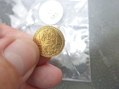 Lot 97 - A small gold coin from Thailand