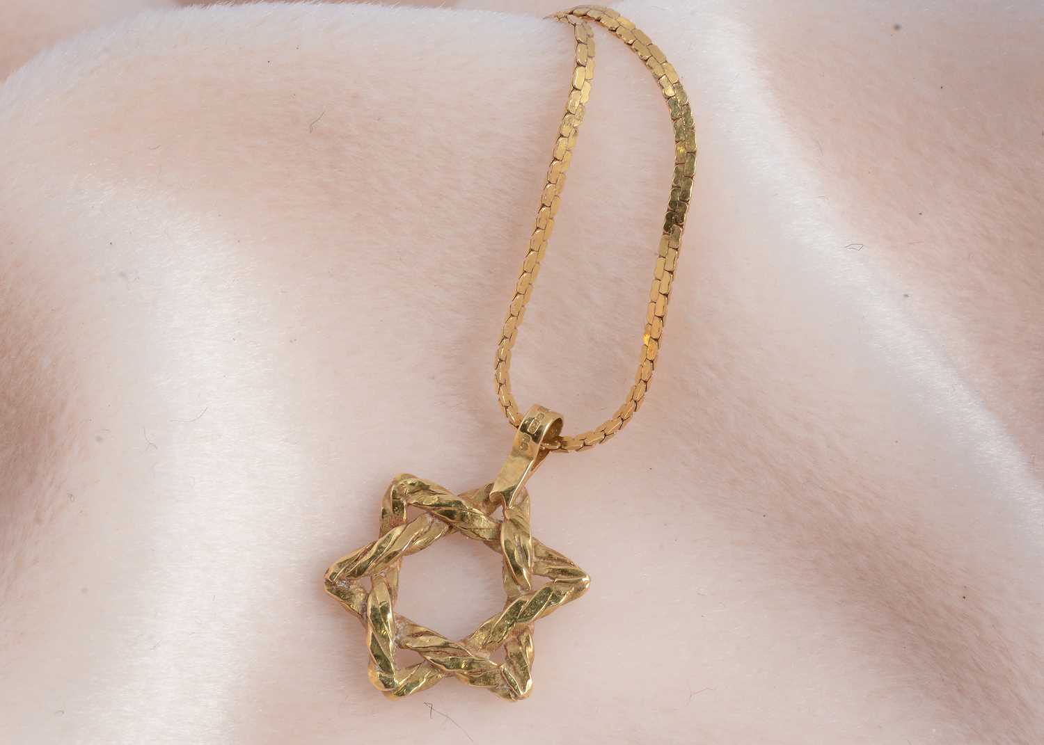 Lot 62 - An 18ct gold Star of David pendant