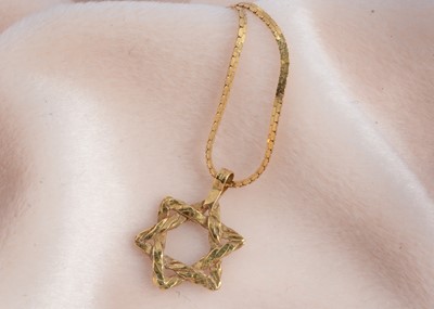 Lot 62 - An 18ct gold Star of David pendant