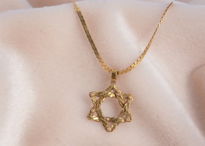 Lot 62 - An 18ct gold Star of David pendant
