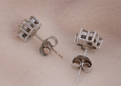 Lot 72 - A pair of diamond stud cluster earrings