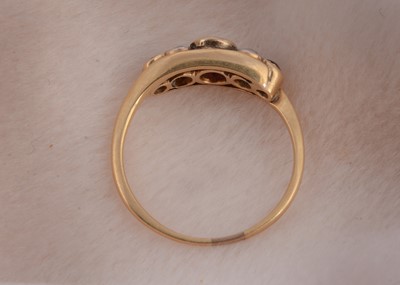 Lot 74 - An 18ct gold platinum, ruby and diamond set five stone dress ring