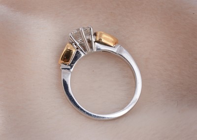 Lot 80 - A three stone emerald and diamond 18ct gold dress ring