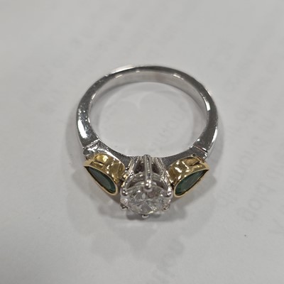 Lot 80 - A three stone emerald and diamond 18ct gold dress ring