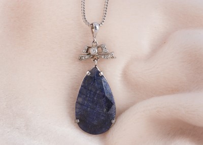 Lot 87 - A sapphire and diamond 9ct gold mounted pendant